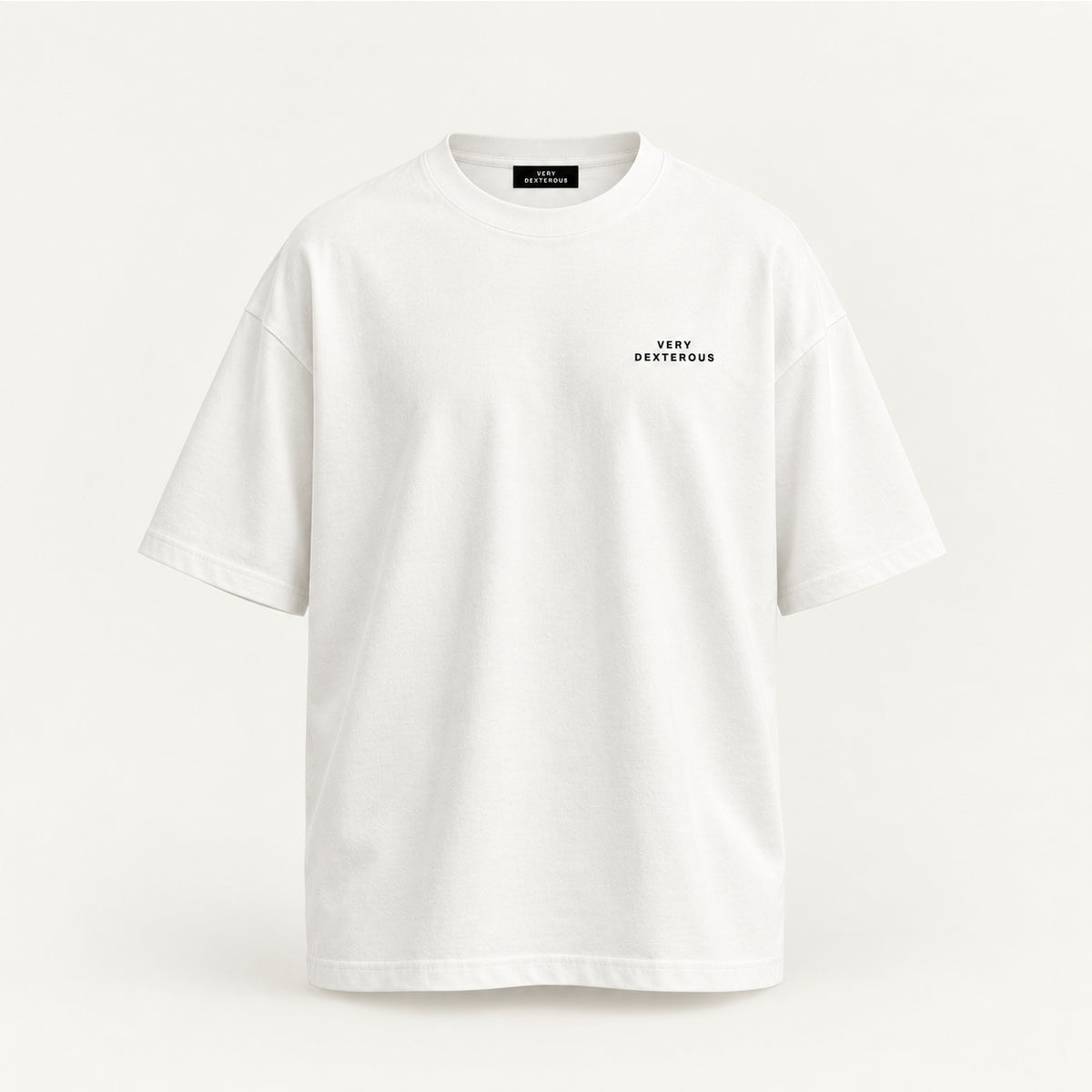 A Very Dexterous oversized white short-sleeve crewneck t-shirt with a small black 'VERY DEXTEROUS' logo printed on the left chest, displayed against a clean off-white background.